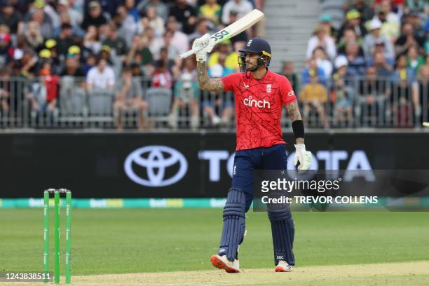 England's Alex Hales celebrates reaching his half century during the first cricket match of the Twenty20 series between Australia and England in...