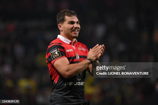 Toulouse's French scrum-half Antoine Dupont applauses at the end of the French Top14 rugby union match between Stade Toulousain Rugby and ASM...