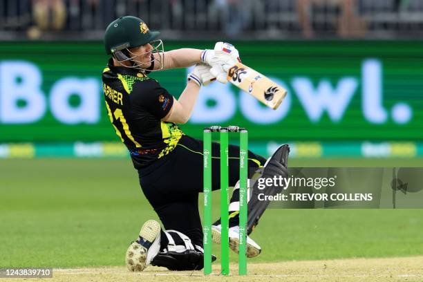 Australia's David Warner plays a shot during the first cricket match of the Twenty20 series between Australia and England at Optus Stadium in Perth...