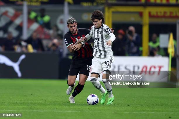 Matias Soule of Juventus FC and Theo Hernandez of AC Milan battle for the ball during the Serie A match between AC MIlan and Juventus at Stadio...