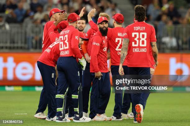 England players celebrate the dismissal of Australia's Tim David during the first cricket match of the Twenty20 series between Australia and England...