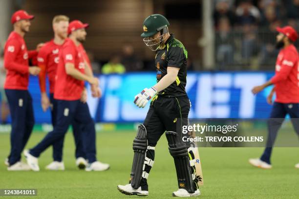 Australia's David Warner leaves the pitch after his dismissal during the first cricket match of the Twenty20 series between Australia and England at...