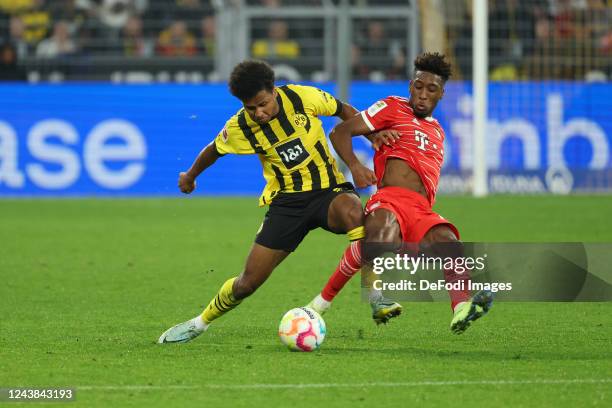 Karim Adeyemi of Borussia Dortmund and Kingsley Coman of Bayern Muenchen battle for the Ball during the Bundesliga match between Borussia Dortmund...