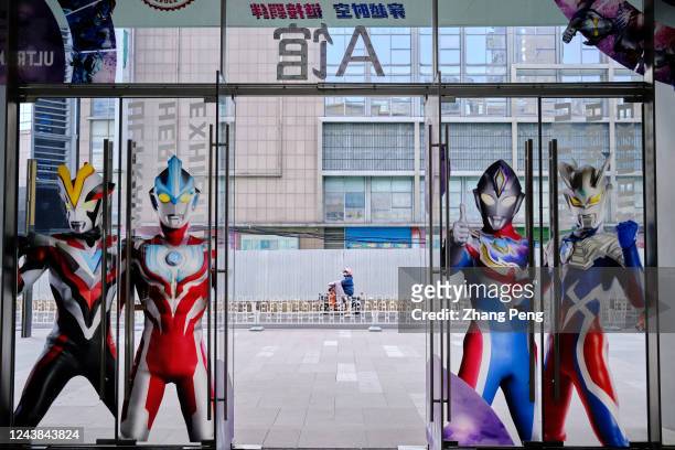 Posters of various Ultraman figures are shown on the glass gate of Tianjin Isetan shopping mall. Ultraman is a heroic character in a Japanese...