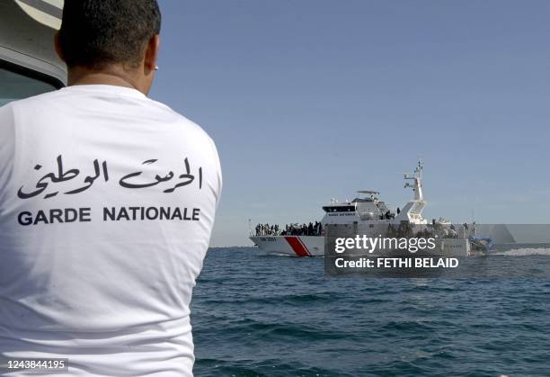 Migrants from sub-Saharan Africa are rescued by the Tunisian National Guard off their makeshift boats which were used to make their way to the...