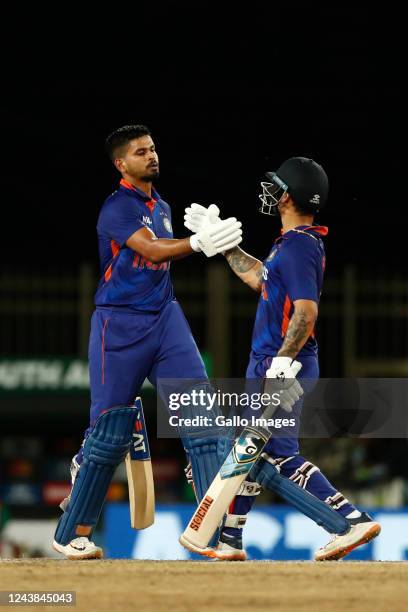 Ishan Kishan and Shreyas Iyer of India celebrate after scoring a fifty during the 2nd One Day International match between India and South Africa at...