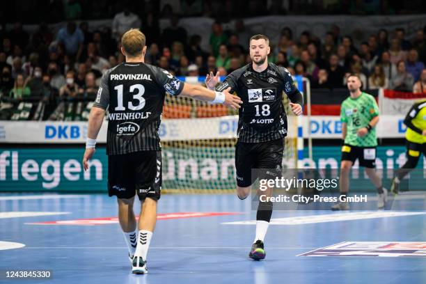 Steffen Weinhold and Niclas Ekberg of THW Kiel during the game between Fuechse Berlin against THW Kiel on October 9, 2022 at Max-Schmeling-Halle in...