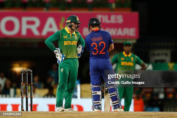 Quinton de Kock of South Africa and Ishan Kishan of India interact during the 2nd One Day International match between India and South Africa at JSCA...