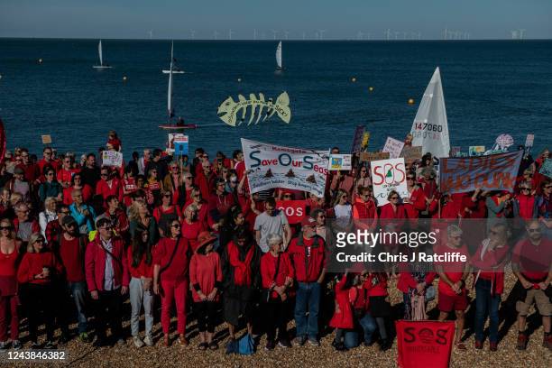 People gather on Tankerton beach to protest against sewage discharges by Southern Water on October 9, 2022 in Whitstable, England. The regional...