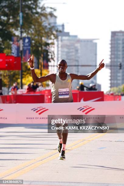 Kenya's Benson Kipruto crosses the finish line to place first in the men's division of the 2022 Bank of America Chicago Marathon in Chicago,...