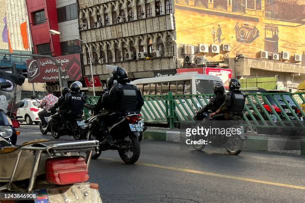 Picture obtained by AFP outside Iran, reportedly shows Iranian police patrolling in the capital Tehran on October 8, 2022. Iran has been torn by the...