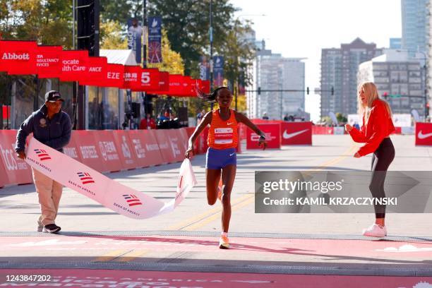 Kenya's Ruth Chepngetich crosses the finish line to place first in the women's division of the 2022 Bank of America Chicago Marathon in Chicago,...