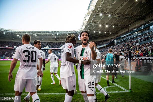 The Team of Borussia Moenchengladbach celebrates after Ramy Bensebaini scored his teams second goal during the Bundesliga match between Borussia...