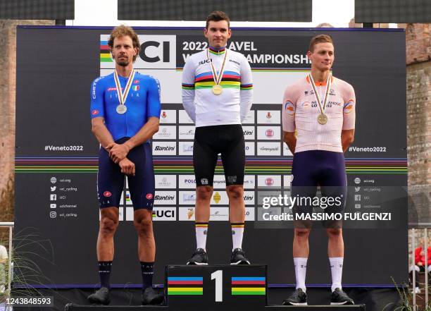 First-placed Belgian rider Gianni Vermeersch , second-placed Italian rider Daniel Oss and third-placed Dutch rider Mathieu Van Der Poel stand on the...