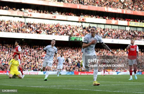 Liverpool's Uruguayan striker Darwin Nunez celebrates after scoring the equalising goal during the English Premier League football match between...