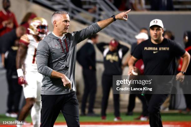 Head coach Mike Norvell of the Florida State Seminoles instructs his team prior to their game against North Carolina State Wolfpack at Carter-Finley...