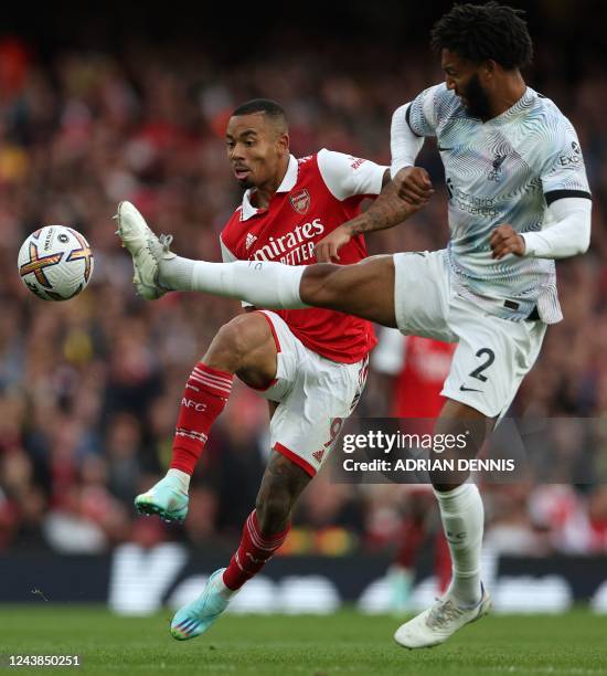 Liverpool's English defender Joe Gomez vies with Arsenal's Brazilian striker Gabriel Jesus during the English Premier League football match between...