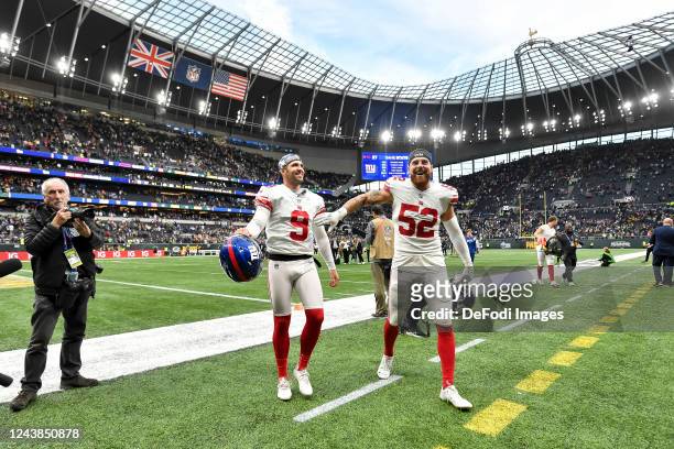 Graham Gano of New York Giants and Carter Coughlin of New York Giants celebrate after winning after the NFL match between New York Giants and Green...