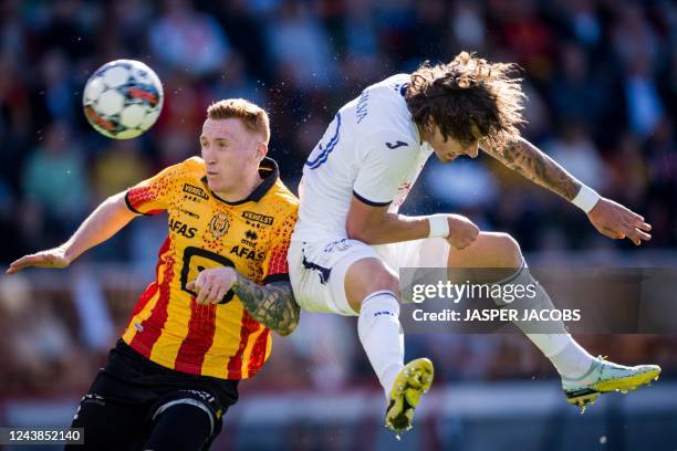 Mechelen's Scottish defender David Bates fights for the ball with Anderlecht's Portuguese forward Fabio Silva during a soccer match between KV...