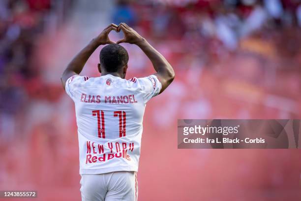Elias Manoel Alves de Paula of New York Red Bulls celebrates his goal by giving a heart to fans in the first half of the Decision Day Major League...