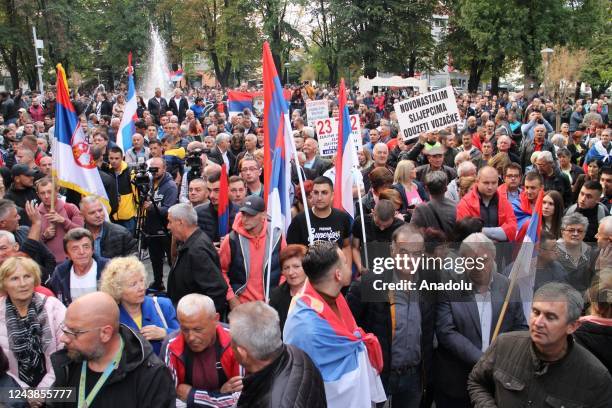 People gather during a protest as the opposition parties in Republika Srpska , one of the two entities of Bosnia and Herzegovina, challenge the RS...