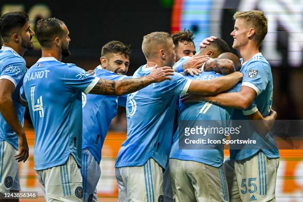 Teammates surround NYCFC forward Héber after he scored a second-half goal during the MLS match between New York City FC and Atlanta United FC on...