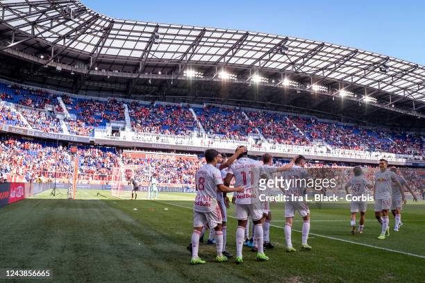 Elias Manoel Alves de Paula of New York Red Bulls celebrates with teammates in the first half of the Decision Day Major League Soccer match against...