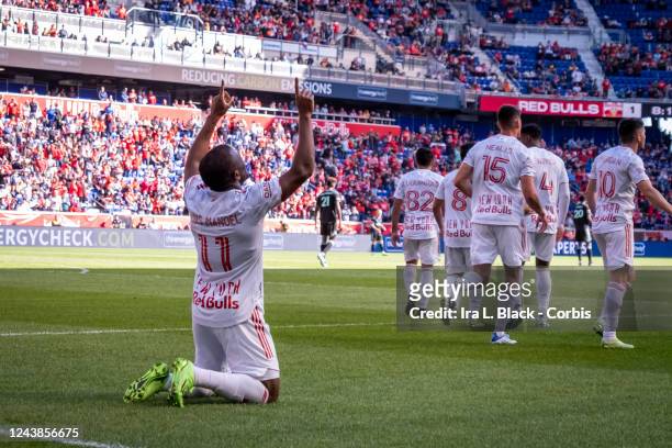 Elias Manoel Alves de Paula of New York Red Bulls takes a moment to kneel and raise his hands to the sky after celebrating with teammates in the...