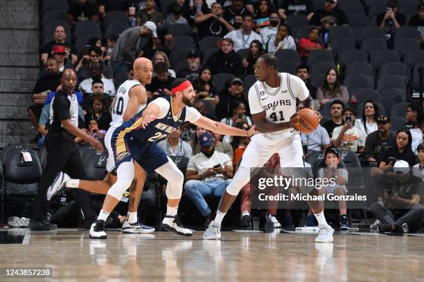 Gorgui Dieng of the San Antonio Spurs looks to pass the ball against the New Orleans Pelicans during a preseason game on October 9, 2022 at the AT&T...