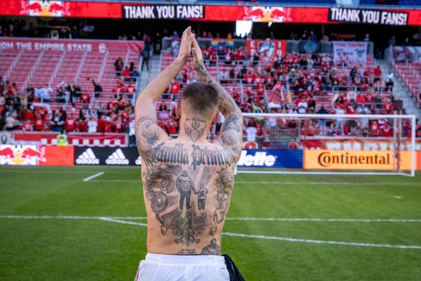 Patryk Klimala of New York Red Bulls claps to fans while the digital board says Thank You Fans after winning the Decision Day Major League Soccer...