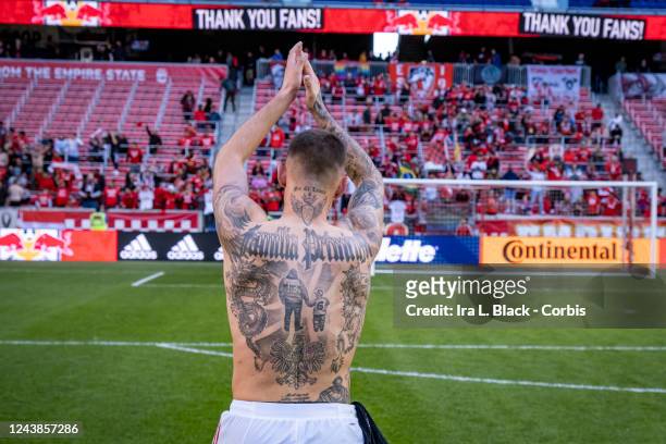 Patryk Klimala of New York Red Bulls claps to fans while the digital board says Thank You Fans after winning the Decision Day Major League Soccer...