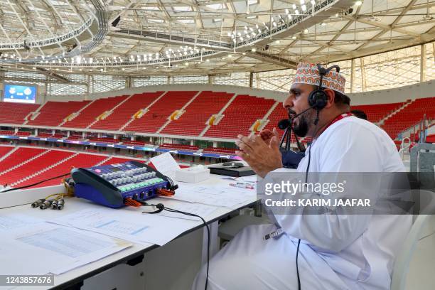 Omani Khalil al-Balushi, a commentator for the Qatari Alkass Sports Channels, is pictured during the Qatar Stars League football match between...