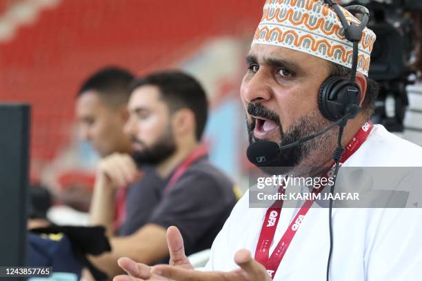 Omani Khalil al-Balushi, a commentator for the Qatari Alkass Sports Channels, is pictured during the Qatar Stars League football match between...