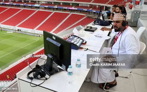 Omani Khalil al-Balushi, a commentator for the Qatari Alkass Sports Channels, is pictured during the Qatar Stars League football match between...