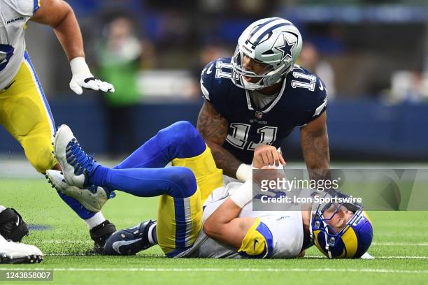 Los Angeles Rams Quarterback Matthew Stafford lays on the turf after fumbling while being sacked by Dallas Cowboys Linebacker Micah Parsons during...