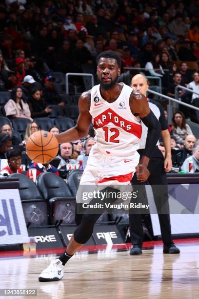 Josh Jackson of the Toronto Raptors dribbles the ball against the Chicago Bulls during a preseason game on October 9, 2022 at the Scotiabank Arena in...