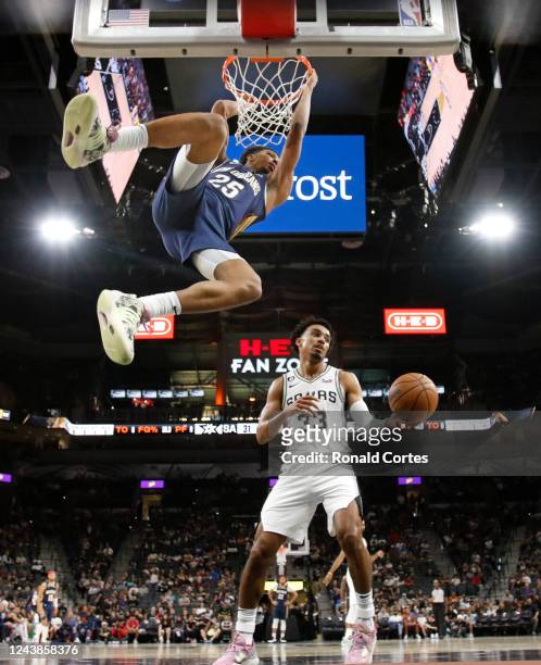 Trey Murphy 111 of the New Orleans Pelicans dunks past Tre Jones of the San Antonio Spurs during the game at AT&T Center on October 9, 2022 in San...