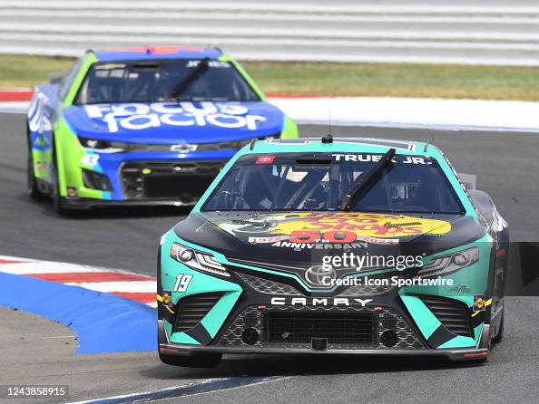 Martin Truex Jr races through Turn 5 during the running of the NASCAR ...