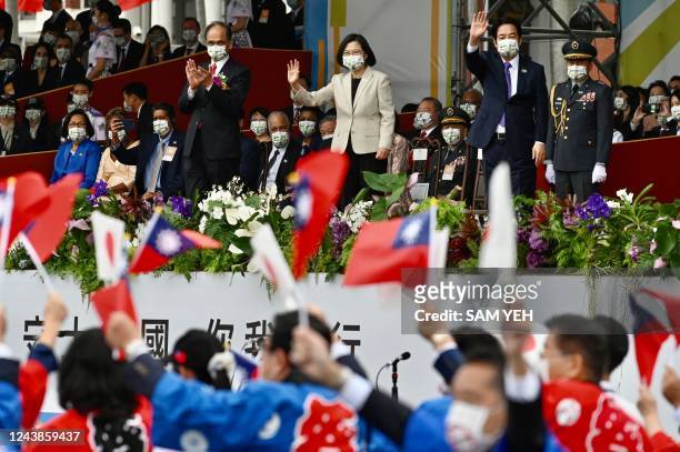 Taiwan's President Tsai Ing-wen attends a ceremony to mark the island's National Day in front of the Presidential Office in Taipei on October 10,...