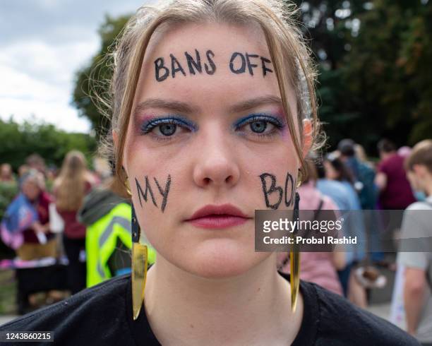 An abortion rights activist painted BANS OFF MY BODY on her face as she gathers to attend a Womens March rally on Capitol Hill in Washington DC. The...