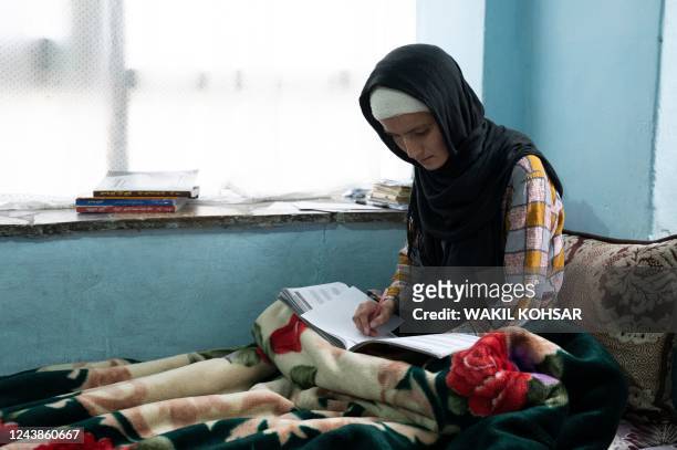 In this photo taken on October 9 Afghan Hazara school girl Masooma Ghafari, who was wounded in a suicide bomb attack at a gender-segregated study...