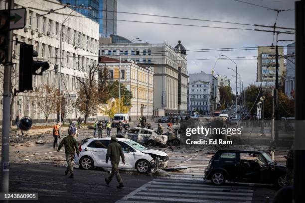 Emergency service personnel attend to the site of a blast on October 10, 2022 in Kyiv, Ukraine. This morning's explosions, which came shortly after...