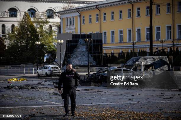 Emergency service personnel attend to the site of a blast on October 10, 2022 in Kyiv, Ukraine. This morning's explosions, which came shortly after...