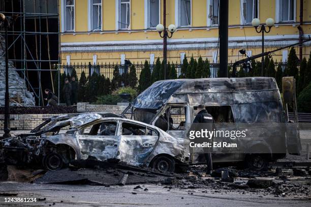 Emergency service personnel attend to the site of a blast on October 10, 2022 in Kyiv, Ukraine. This morning's explosions, which came shortly after...