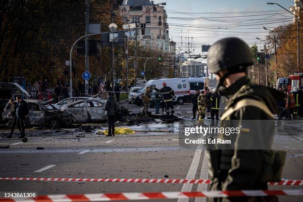 Emergency service personnel attend to the site of a blast on October 10, 2022 in Kyiv, Ukraine. This morning's explosions, which came shortly after...