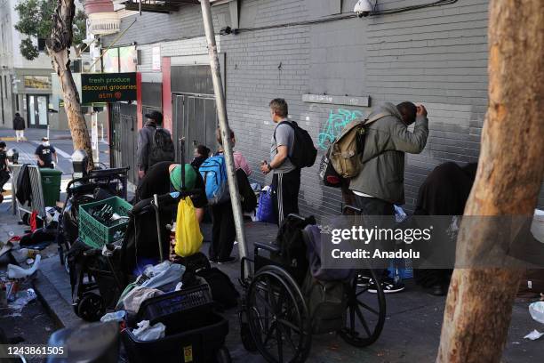 Homeless people are seen in Tenderloin district of San Francisco in California, United States on October 9, 2022.