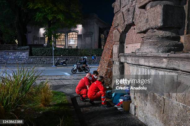 Volunteers of Croce Rossa Italiana give assistance to a homeless man in central Milan, Italy on October 7, 2022. October 10th marks World Homeless...