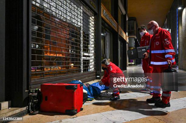 Volunteers of Croce Rossa Italiana give assistance to a homeless man in central Milan, Italy on October 7, 2022. October 10th marks World Homeless...