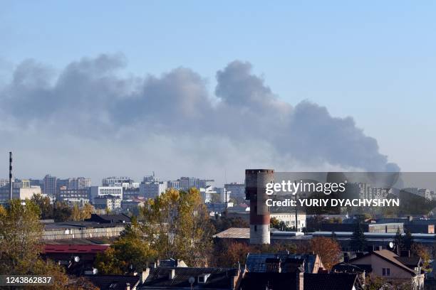 Smoke rises above buildings in the western Ukrainian city of Lviv after Russian missile strike on October 10 amid Russian invasion of Ukraine.