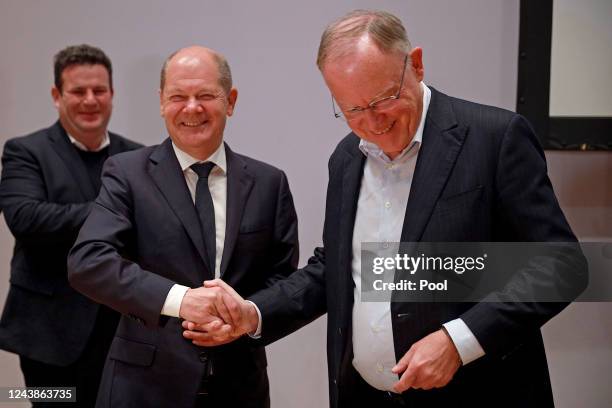 German Chancellor Olaf Scholz congratulates State Premier and leader of the Social Democratic Party in Lower Saxony Stephan Weil at SPD federal...